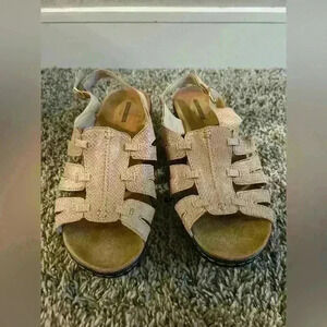 Woman’s tan collection by Clark sandals size 9